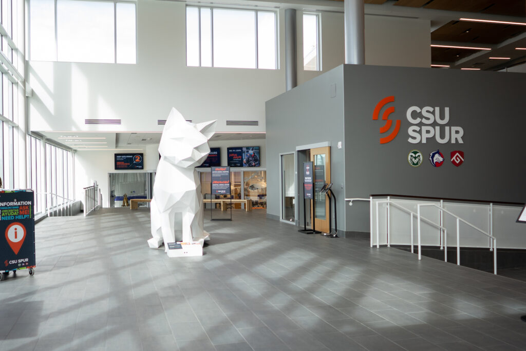Empty lobby with a large white cat statue.